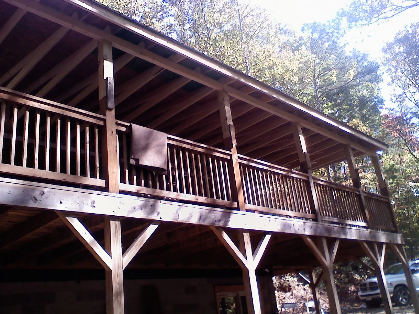 Timber framing under a new elevated porch and deck — Roof Leak Repair in Century by Roofing Brothers